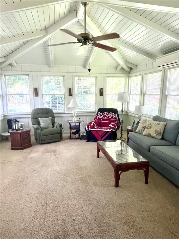 119 Saint Clair Dr, Saint Simons Island, GA 31522 - living room with a wall unit AC, carpet, and ceiling fan