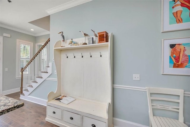 mudroom with dark wood-style flooring, baseboards, and ornamental molding