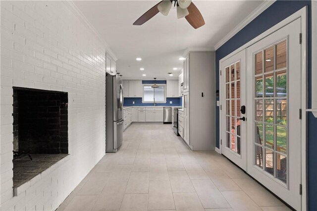1207 Lanier Blvd, Brunswick, GA 31520 - hall with light tile patterned floors, crown molding, and french doors