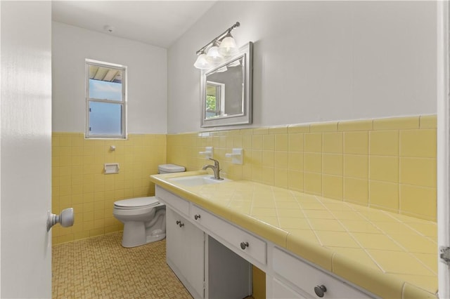 1207 Lanier Blvd, Brunswick, GA 31520 - bathroom featuring vanity, toilet, and tile walls