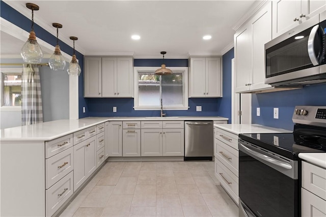 1207 Lanier Blvd, Brunswick, GA 31520 - kitchen with pendant lighting, sink, ornamental molding, and stainless steel appliances