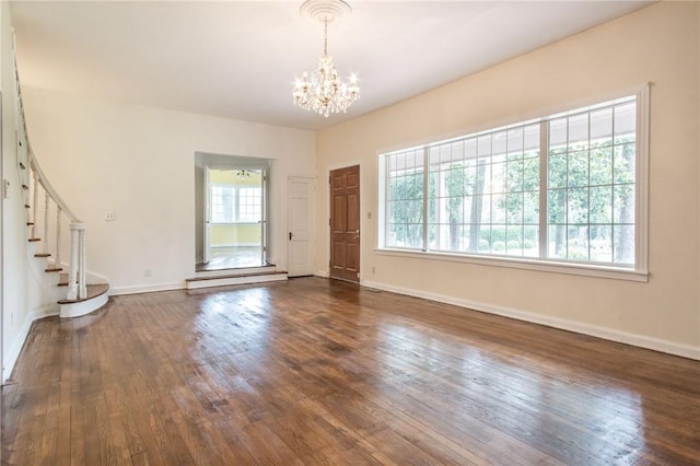 1701 Satilla Blvd, Waycross, GA 31501 - foyer entrance with a chandelier, stairs, dark wood-style flooring, and baseboards