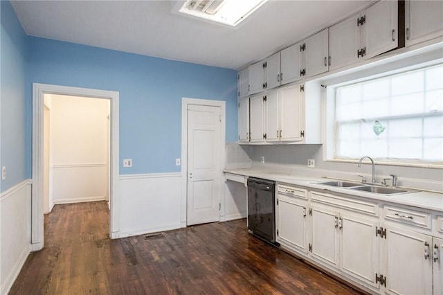 1701 Satilla Blvd, Waycross, GA 31501 - kitchen featuring dishwasher, a sink, light countertops, and dark wood-style floors