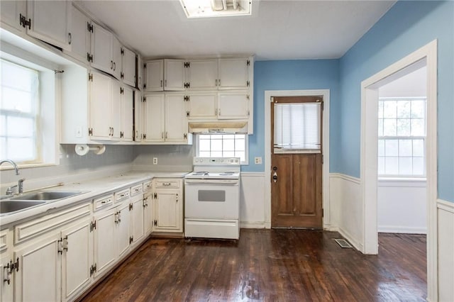 1701 Satilla Blvd, Waycross, GA 31501 - kitchen with electric stove, a wainscoted wall, dark wood finished floors, a sink, and light countertops
