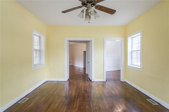 1701 Satilla Blvd, Waycross, GA 31501 - empty room with dark wood-style floors, a ceiling fan, and baseboards