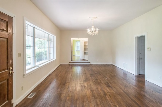 1701 Satilla Blvd, Waycross, GA 31501 - unfurnished dining area with a chandelier, dark wood-style floors, and baseboards