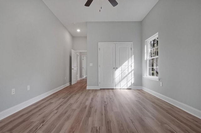 spare room featuring ceiling fan and light wood-type flooring