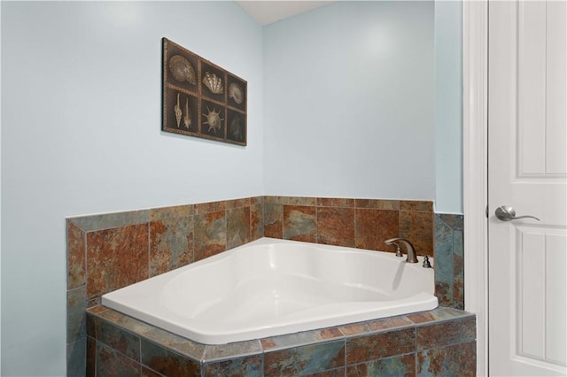 bathroom featuring a relaxing tiled tub