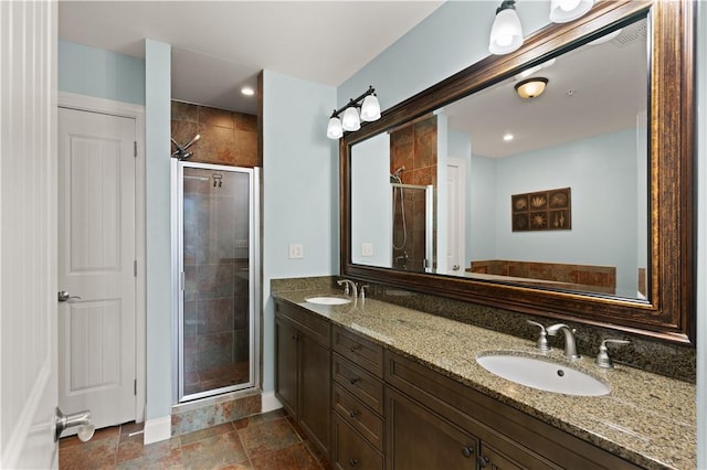 bathroom with vanity and an enclosed shower