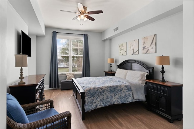 bedroom with light hardwood / wood-style floors and ceiling fan