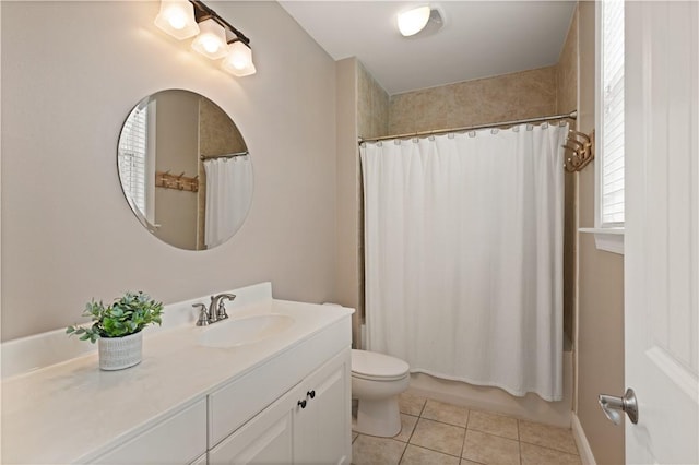 full bathroom featuring tile patterned floors, shower / tub combo with curtain, vanity, and toilet