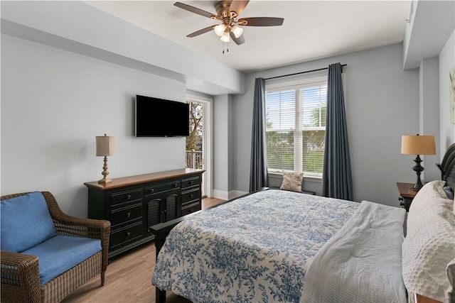 bedroom with light hardwood / wood-style flooring and ceiling fan