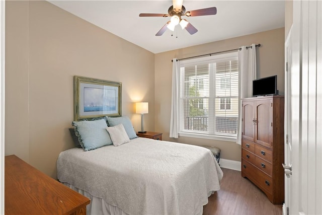 bedroom featuring light hardwood / wood-style floors and ceiling fan