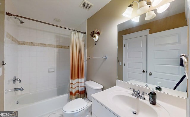 full bathroom featuring vanity, shower / bath combination with curtain, and toilet