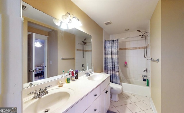 full bathroom featuring tile patterned floors, shower / bath combo, toilet, and vanity