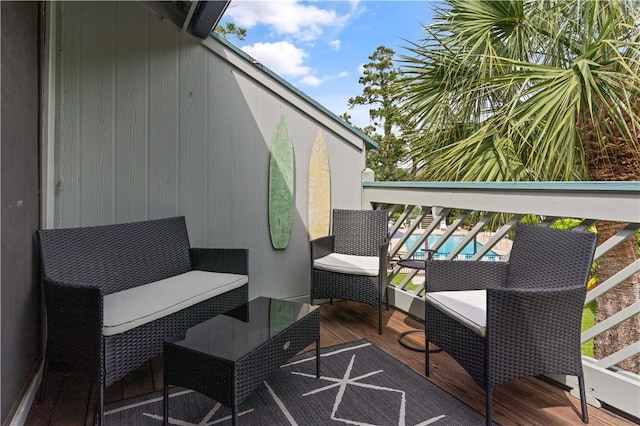 wooden deck featuring an outdoor living space