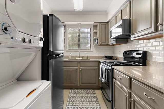 kitchen with crown molding, sink, decorative backsplash, light tile patterned flooring, and stainless steel appliances