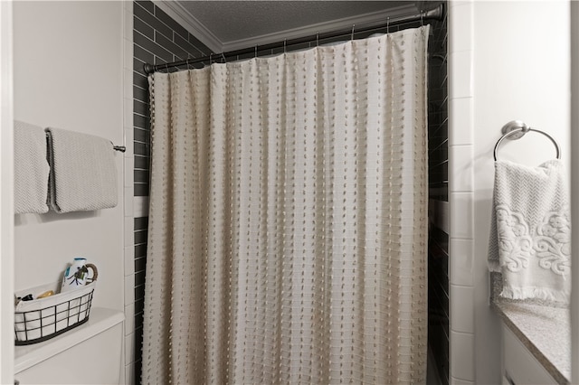 bathroom with toilet, crown molding, a textured ceiling, and walk in shower