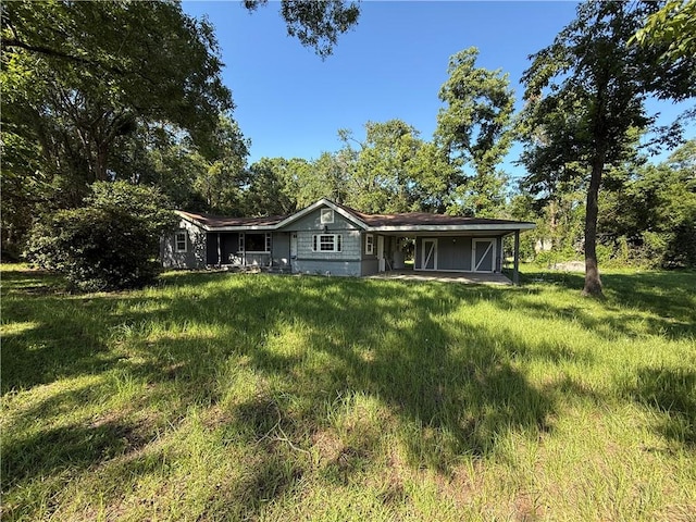 4427 Pine Valley Rd, Waycross, GA 31503 - back of house featuring a lawn