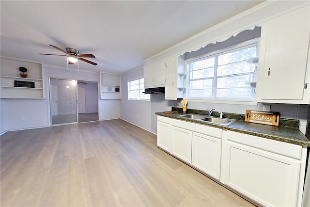 kitchen featuring sink, light hardwood / wood-style flooring, white cabinets, and ceiling fan