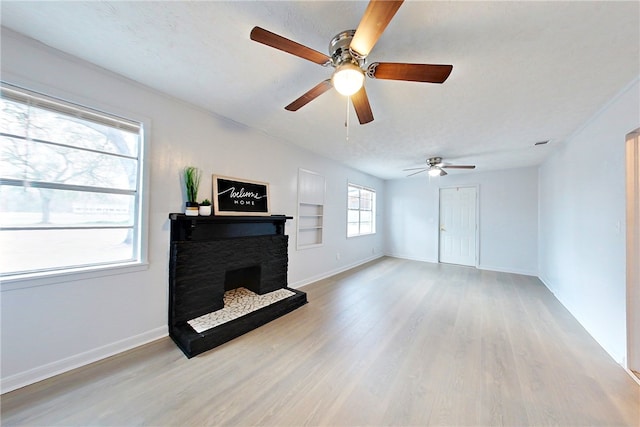 living room with light hardwood / wood-style floors and built in features