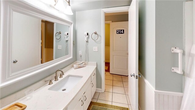 bathroom with tile patterned floors and vanity