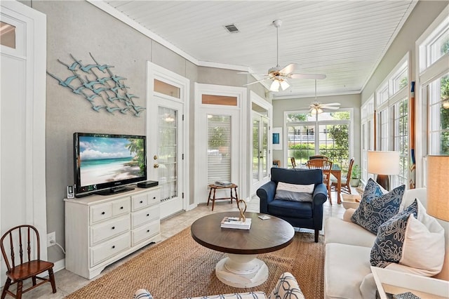 916 Rose Cottage Rd, Saint Simons Island, GA 31522 - living area featuring plenty of natural light, a ceiling fan, ornamental molding, and light tile patterned floors