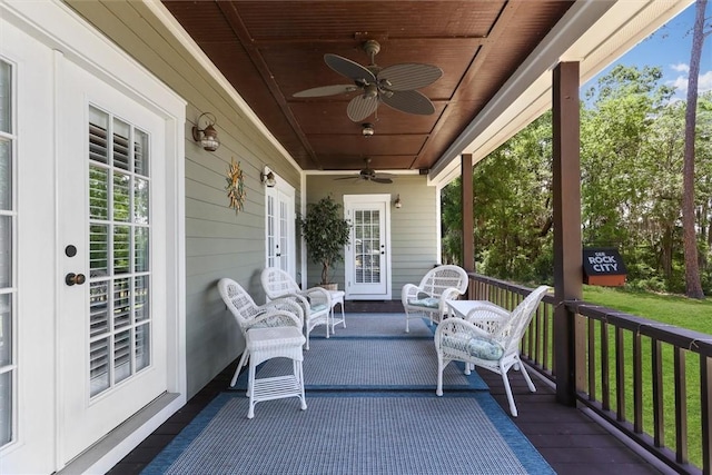 exterior space with a porch, french doors, and ceiling fan