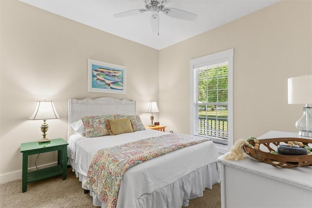 bedroom featuring baseboards, ceiling fan, and light colored carpet