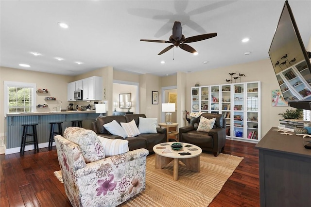 living room with recessed lighting, dark wood-style flooring, and ceiling fan