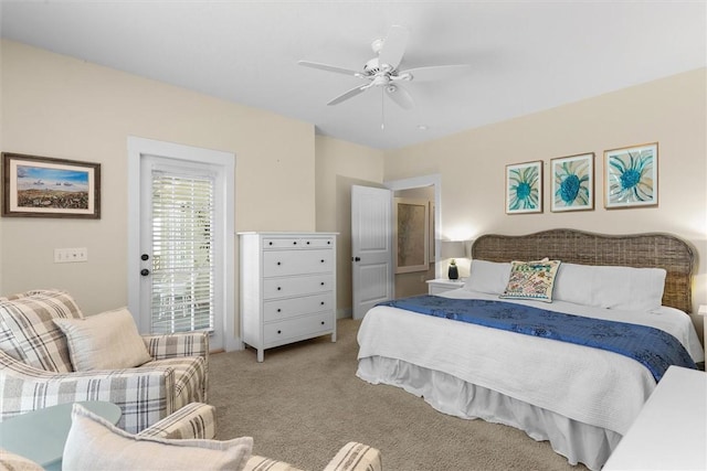 bedroom with a ceiling fan, light colored carpet, and access to outside