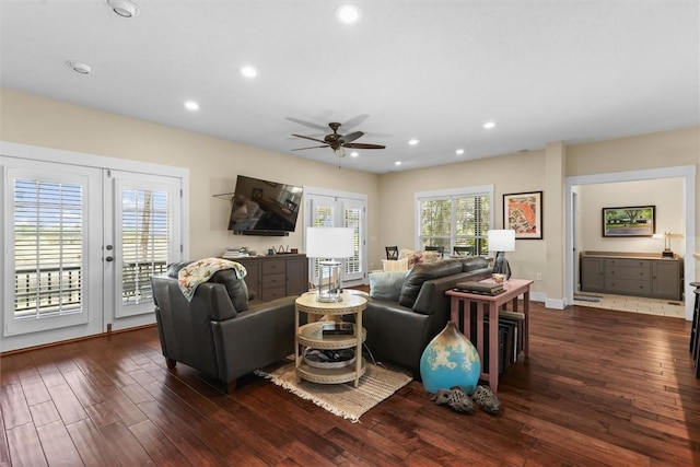 living room featuring a ceiling fan, baseboards, recessed lighting, and hardwood / wood-style floors