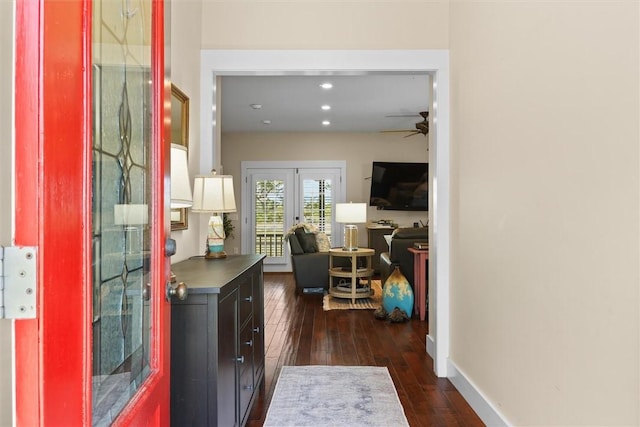 hallway with baseboards, dark wood-style flooring, and recessed lighting