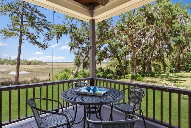 1261 Otter Slide Loop, Townsend, GA 31331 - wooden deck featuring a lawn