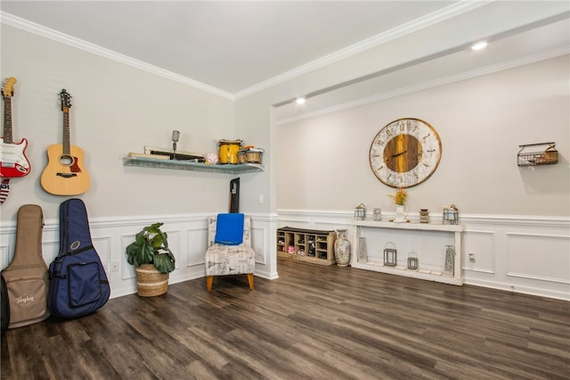140 Clearwater Dr, Brunswick, GA 31523 - living area with wood finished floors, crown molding, a decorative wall, and wainscoting