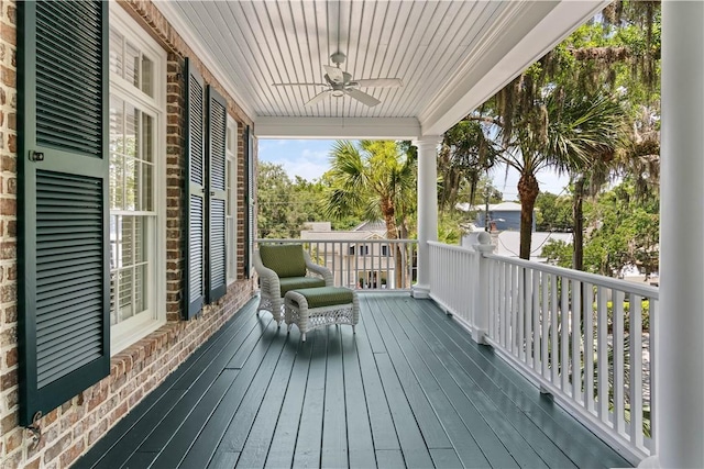 wooden deck with ceiling fan and covered porch