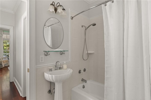 bathroom with shower / bathtub combination with curtain, wood-type flooring, and crown molding