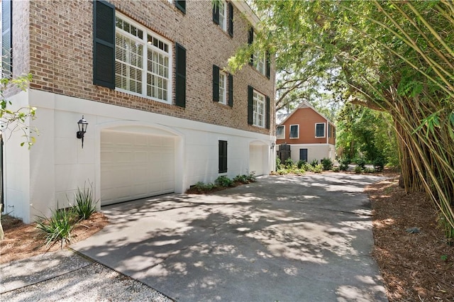 view of side of property featuring a garage