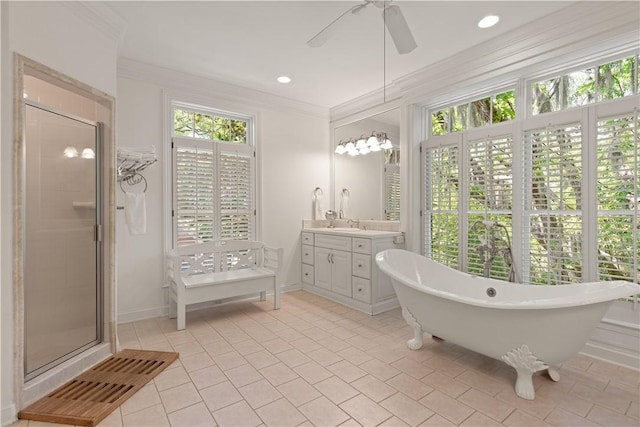 bathroom featuring vanity, ceiling fan, ornamental molding, and shower with separate bathtub