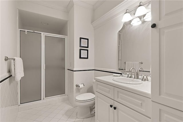 bathroom featuring tile patterned flooring, vanity, walk in shower, and crown molding