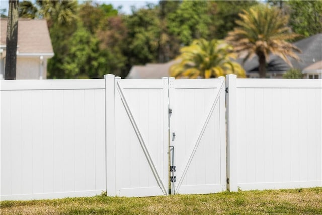 view of gate with fence