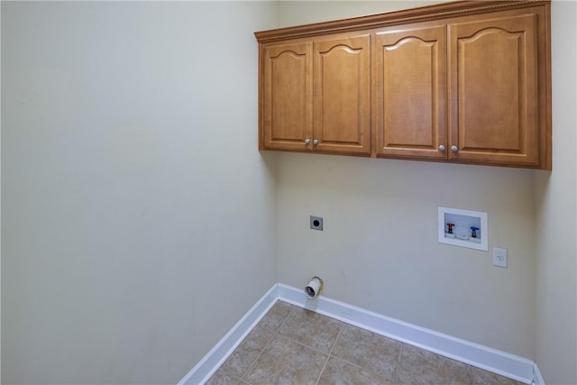 clothes washing area featuring light tile patterned floors, baseboards, hookup for an electric dryer, cabinet space, and hookup for a washing machine
