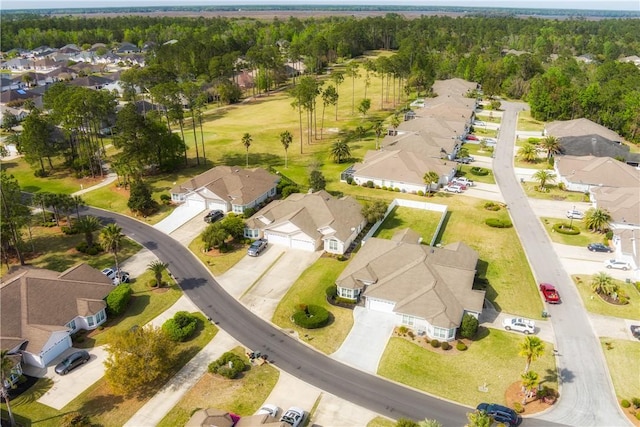 birds eye view of property featuring a view of trees and a residential view