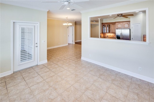 interior space featuring visible vents, baseboards, light tile patterned floors, ornamental molding, and ceiling fan with notable chandelier