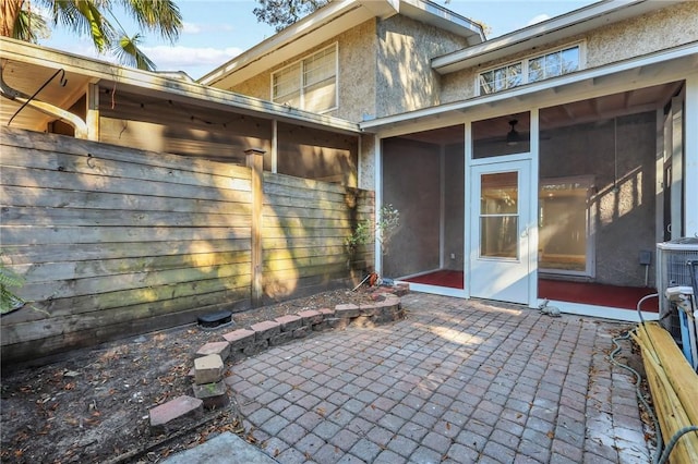 view of patio with a sunroom