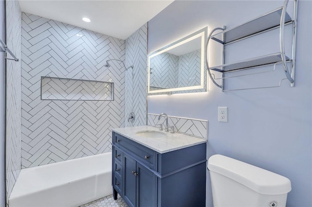 full bathroom with vanity, toilet, and tiled shower / bath