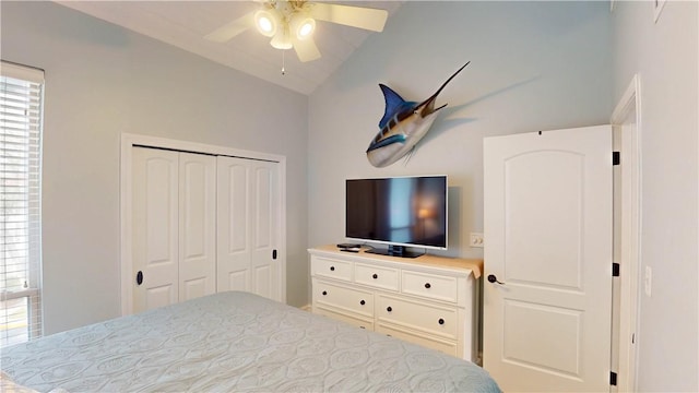 bedroom featuring a closet, a ceiling fan, and vaulted ceiling