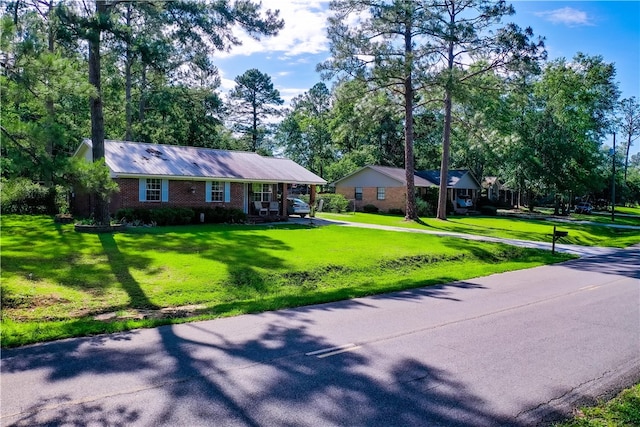 940 Azalea St, Blackshear, GA 31516 - ranch-style house with a front lawn, brick siding, and driveway