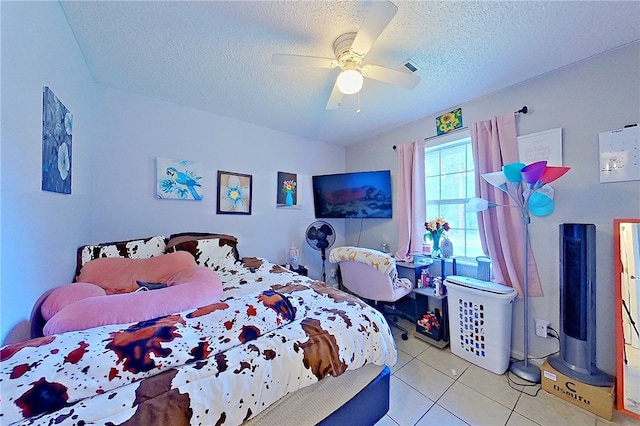 940 Azalea St, Blackshear, GA 31516 - bedroom with a textured ceiling, light tile patterned flooring, and ceiling fan