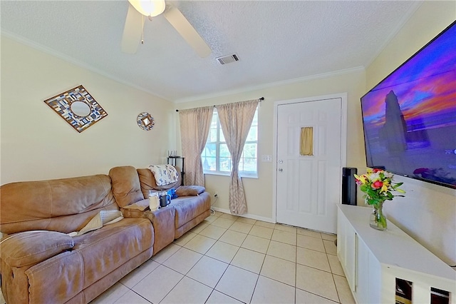 940 Azalea St, Blackshear, GA 31516 - living room with ceiling fan, light tile patterned floors, crown molding, a textured ceiling, and baseboards